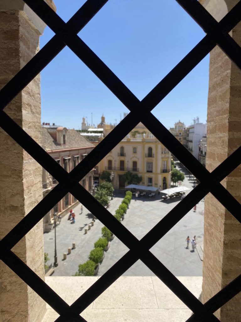 Looking out to a street of Sevilla from a window in the bell tower